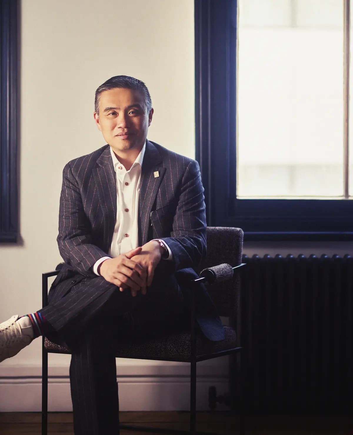 Professor Paul Lee seated in his London clinic